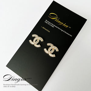 Gold tone cc earrings encrusted with swarovski 060721