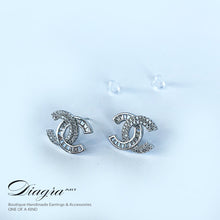 Load image into Gallery viewer, CC earrings silver tone encrusted with Swarovski Diagra Art 2402235